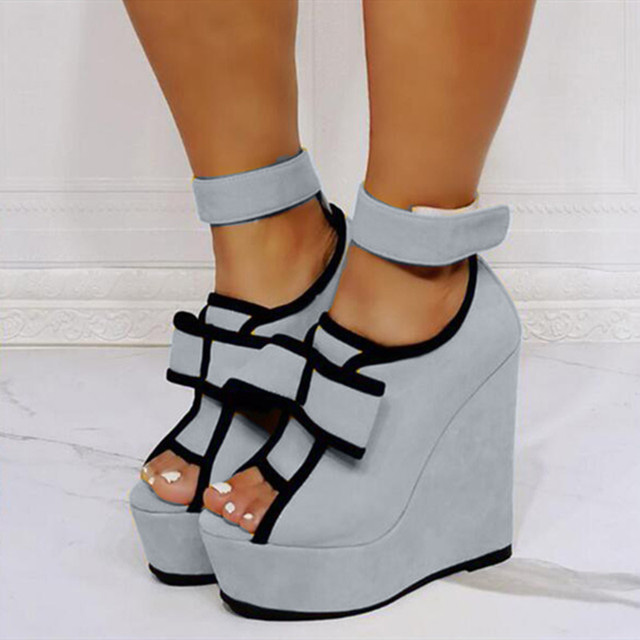 Peep Toe Ankle Buckle Straps Ribbon Platforms Wedges - Gray - Shaft Material: Flock
Insole Material: Faux Leather
Lining Material: Synthetic
Outsole Material: Rubber

US: 3 (8.46 inch) - EU: 33 ( 21.5 cm)
US: 4 (8.66 inch) - EU: 34 ( 22 cm)
US: 5 (8.86 inch) - EU: 35 ( 22.5 cm)
US: 6 (9.05 inch) - EU: 36 ( 23 cm)
US: 7 (9.25 inch) - EU: 37 ( 23.5 cm)
US: 8 (9.44 inch) - EU: 38 ( 24 cm)
US: 8.5 (9.64 inch) - EU: 39 ( 24.5 cm)
US: 9 (9.85 inch) - EU: 40 ( 25 cm)
US: 9.5 (10.03 inch) - EU: 41 ( 25.5 cm)
US: 10 (10.23 inch) - EU: 42 ( 26 cm)
US: 10.5 (10.43 inch) - EU: 43 ( 26.5 cm)
US: 11 (10.62 inch) - EU: 44 ( 27 cm)
US: 12 (10.82 inch) - EU: 45 ( 27.5 cm)
US: 13 (11.02 inch) - EU: 46 ( 28 cm)
US: 14 (11.22 inch) - EU: 47 ( 28.5 cm)
US: 15 (11.41 inch) - EU: 48 ( 29 cm)
US: 16 (11.61 inch) - EU: 49 ( 29.5 cm)
US: 17 (11.81 inch) - EU: 50 ( 30 cm)
US: 18 (12 inch) - EU: 51 ( 30.5 cm)
US: 19 (12.20 inch) - EU: 52 ( 31 cm) in Sexy Heels & Platforms